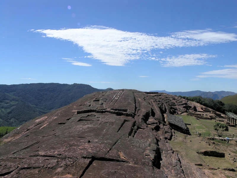 Wide view of the carved rock at El Fuerte de Samaipata among the Santa Cruz valleys.