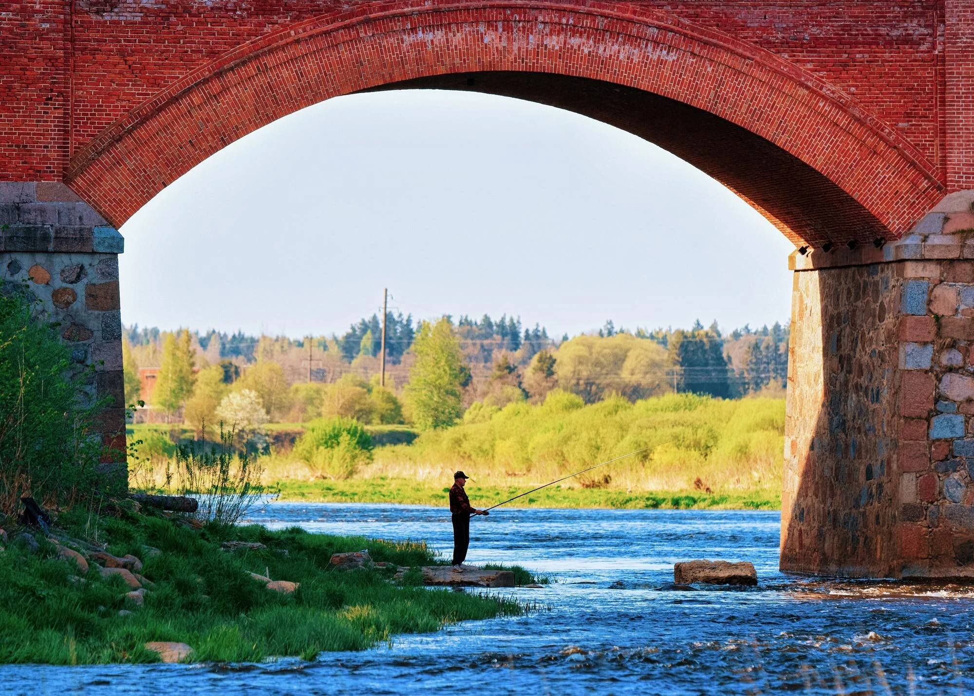 Ventas Rumba waterfall and the historic brick bridge over the Venta River in Kuldīga.