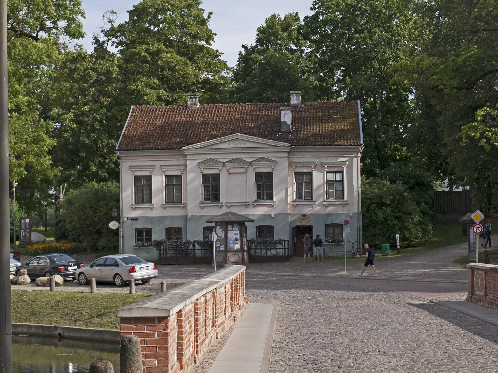 Alekšupīte stream beside historic buildings and small bridges in Kuldīga.