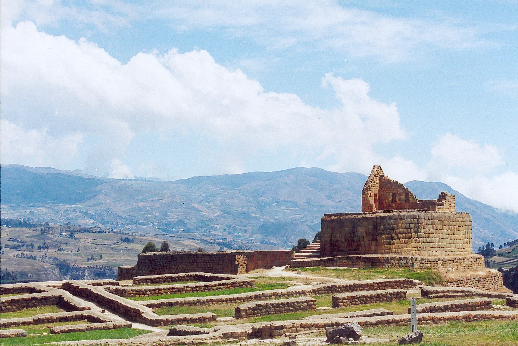 Stone structures at Ingapirca Archaeological Complex with the Temple of the Sun.