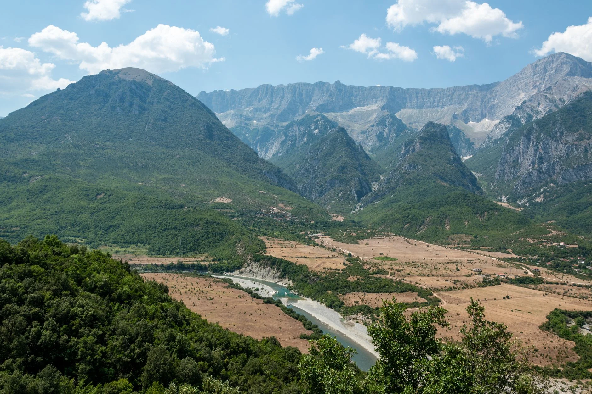 Aerial view of the Përmet valley, with greenery and mountains in Albania.