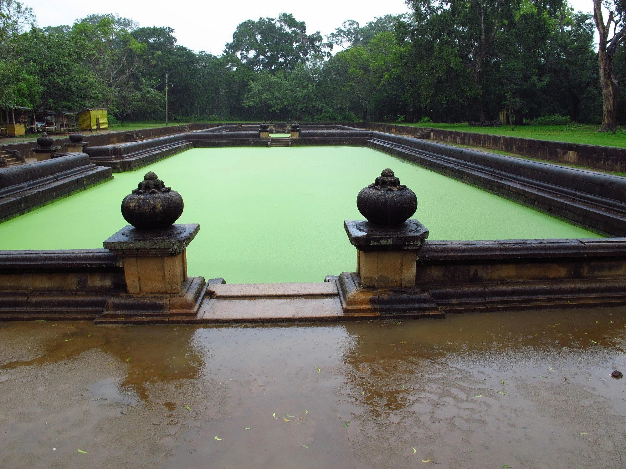 Stone steps and water at the Kuttam Pokuna twin ponds in Anuradhapura.