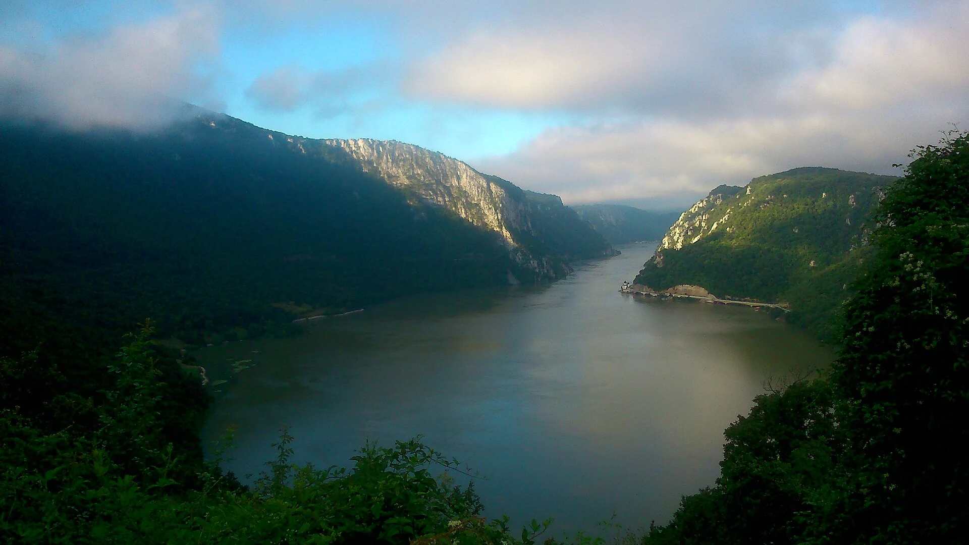 The Danube between forested slopes in Đerdap National Park.