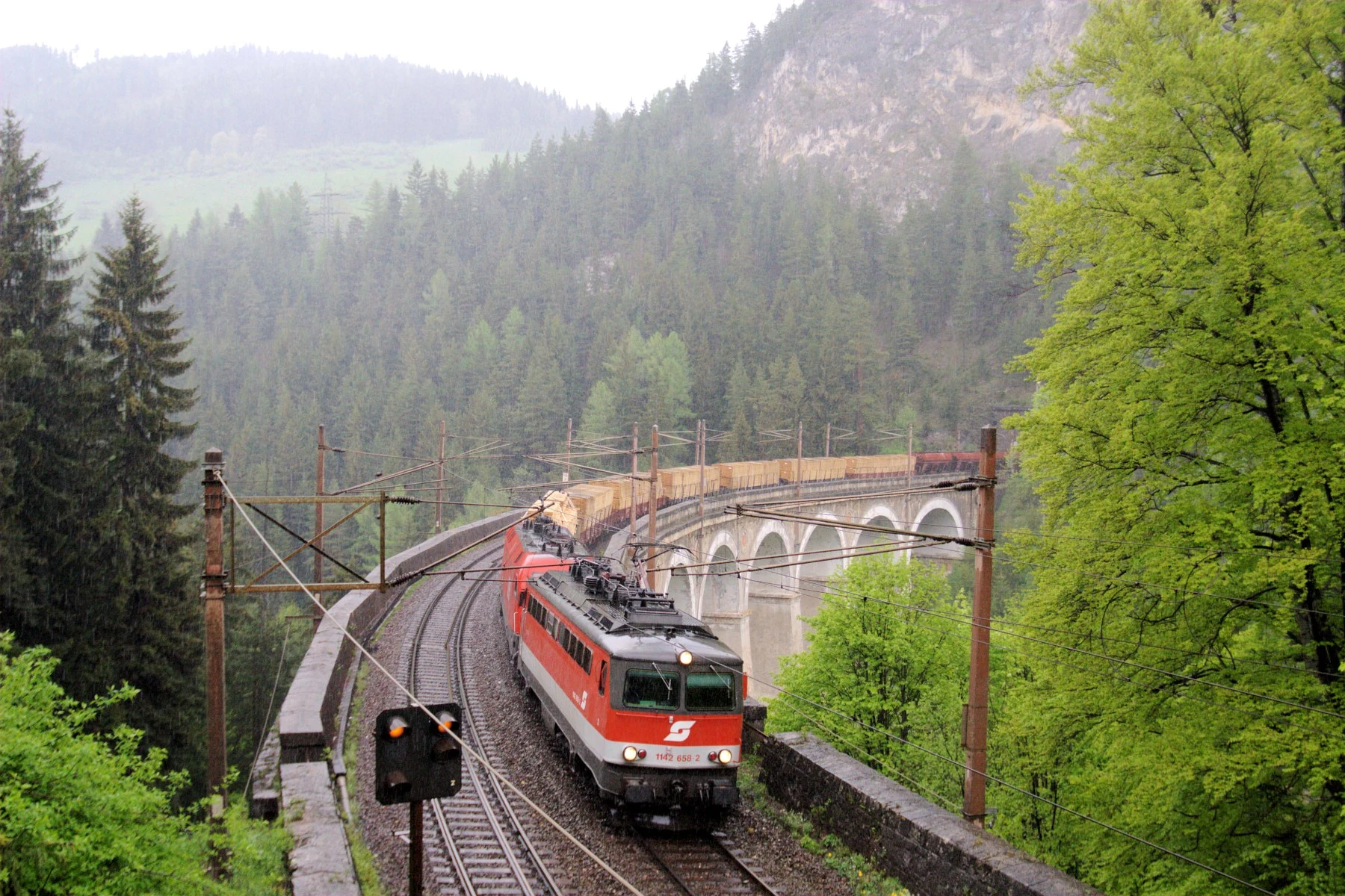 Kalte Rinne viaduct on the Semmering Railway amid forested Alpine slopes.
