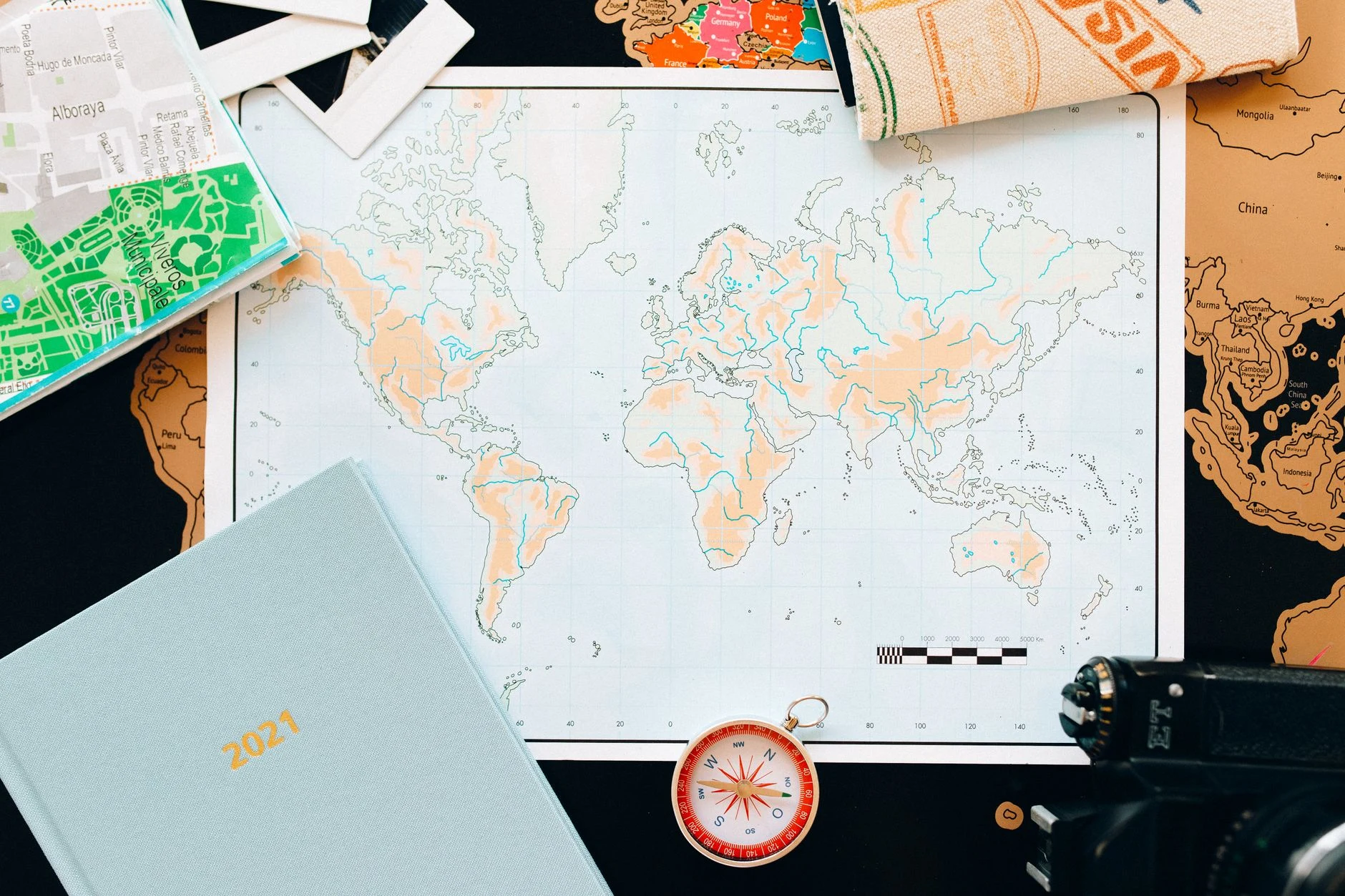 Traveller consulting a map and notes for a trip to Ghana.