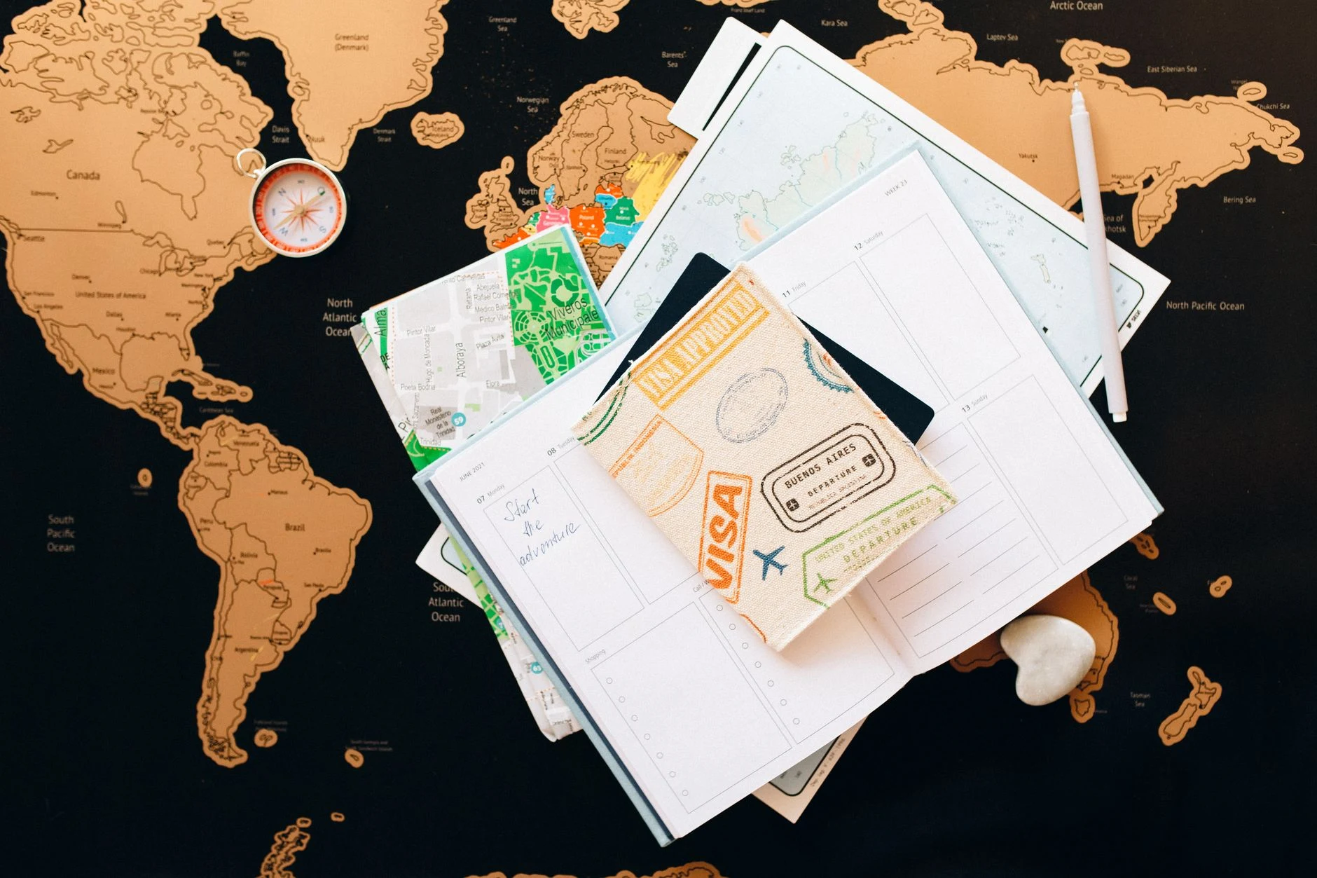 Map and notebook for planning a trip to Suriname