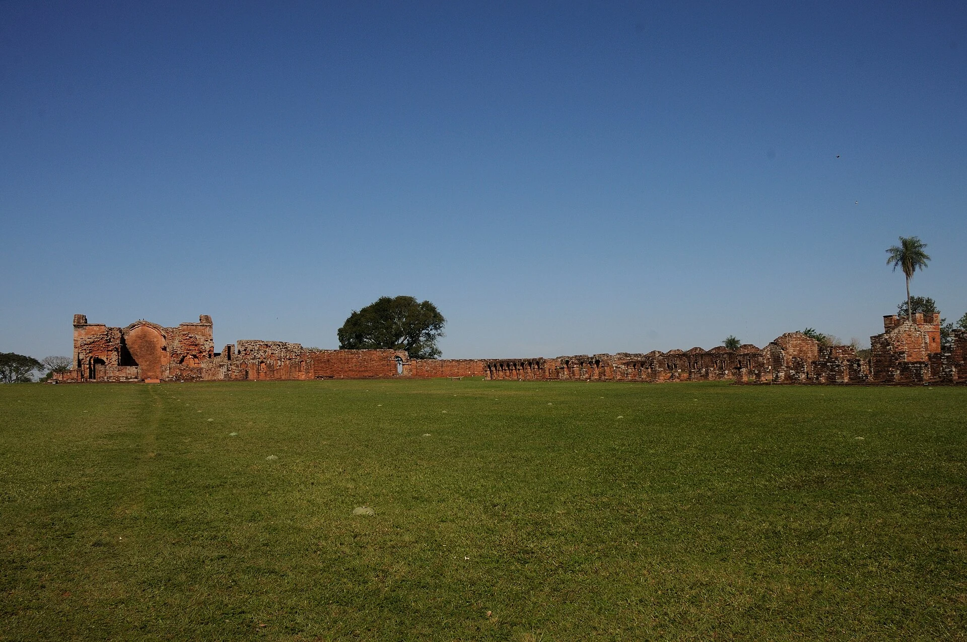 Stone plaza and arcades at the Jesuit Mission of Santísima Trinidad del Paraná.