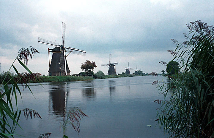 Kinderdijk windmills beside a canal and dike