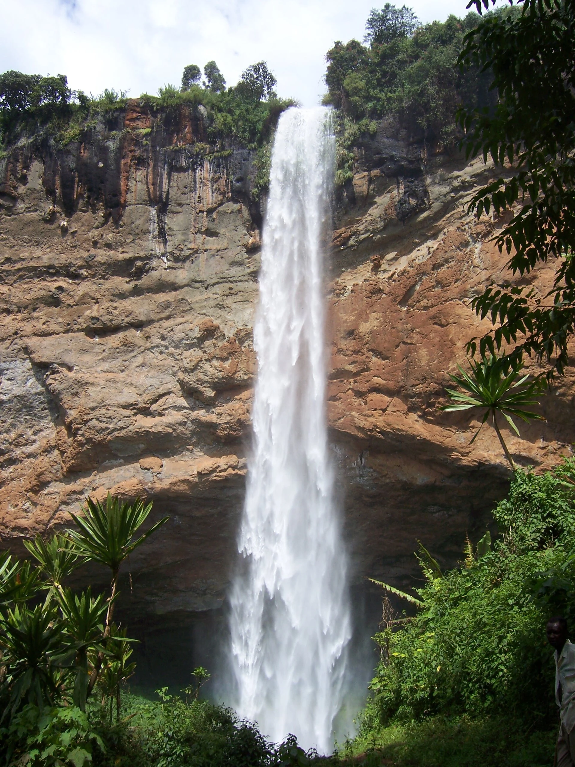 Waterfall among basalt cliffs at Sipi Falls, Uganda.