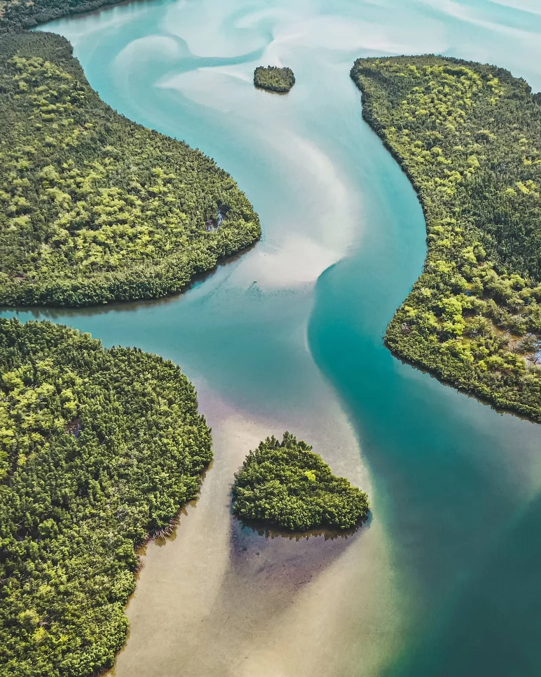 Lake Piso lagoon with a wooded shore in Liberia.