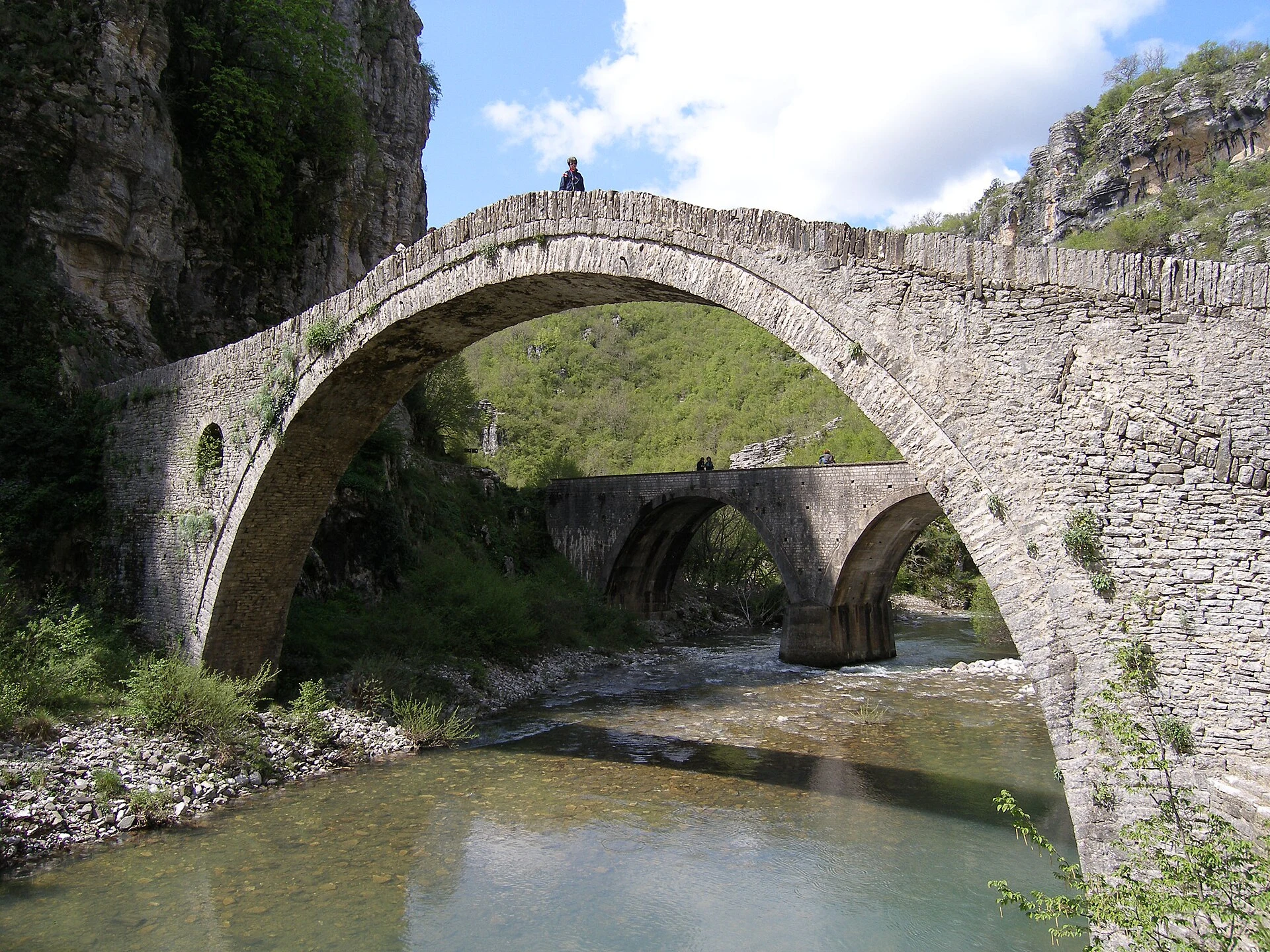 Stone arched bridge over a watercourse in Zagori.