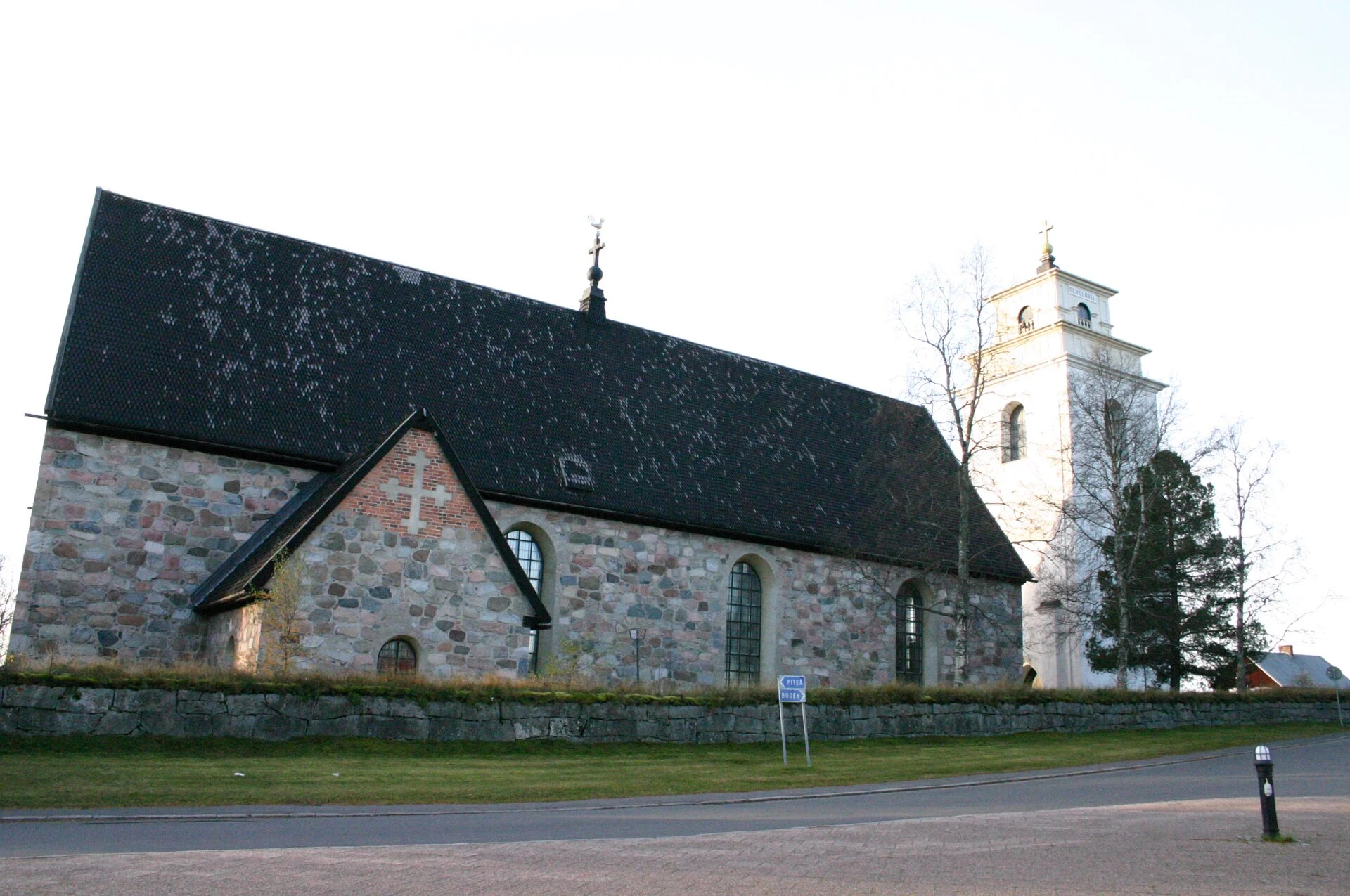 Narrow lane between wooden church cottages in Gammelstad.
