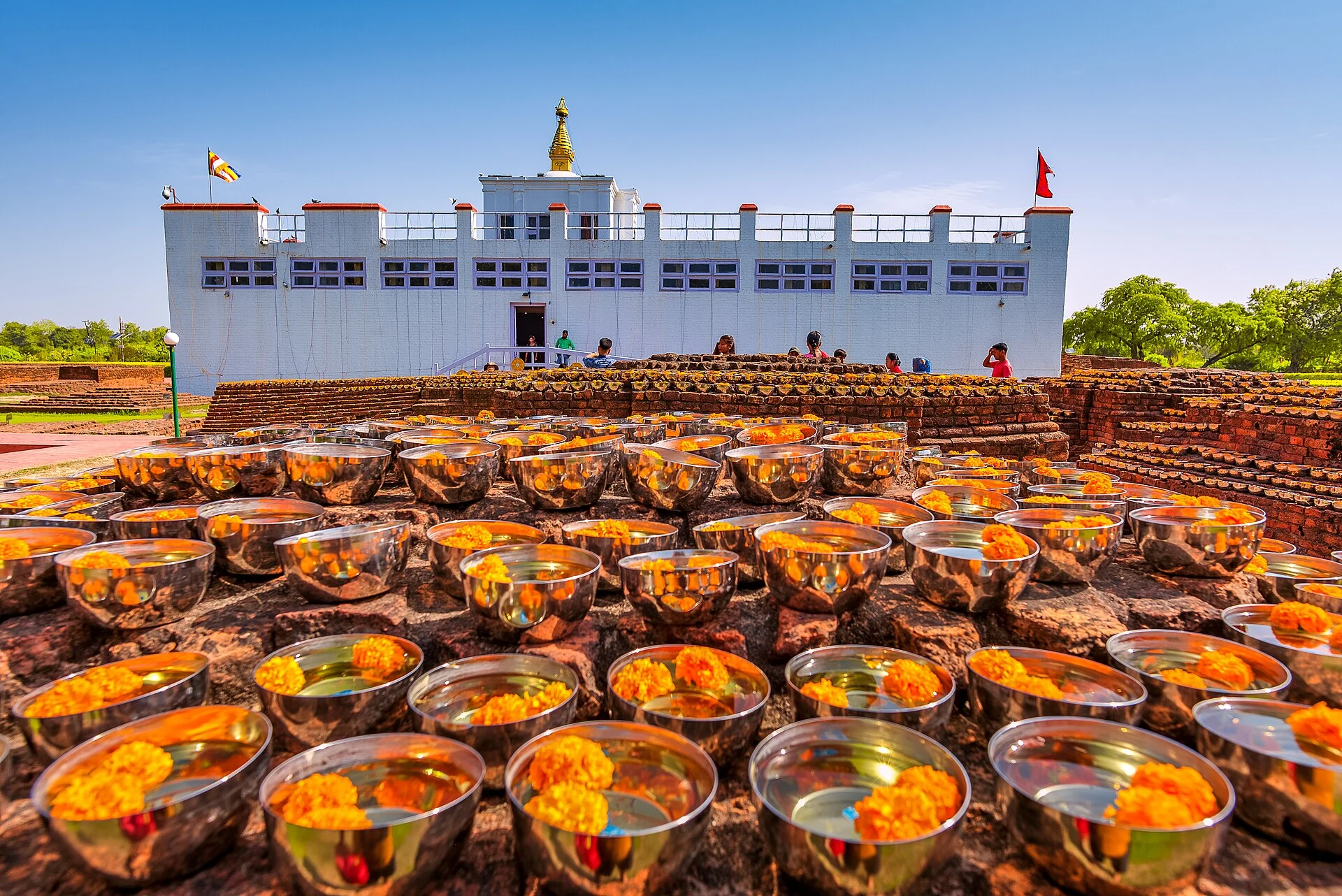 Maya Devi Temple with an offering of water and flowers in Lumbini, Nepal.
