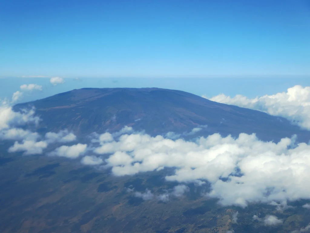 Mount Karthala rising above inhabited lowlands on Grande Comore