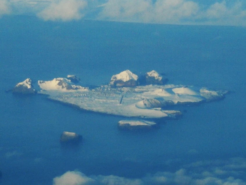 Eldfell volcanic cone above Heimaey town and harbour.