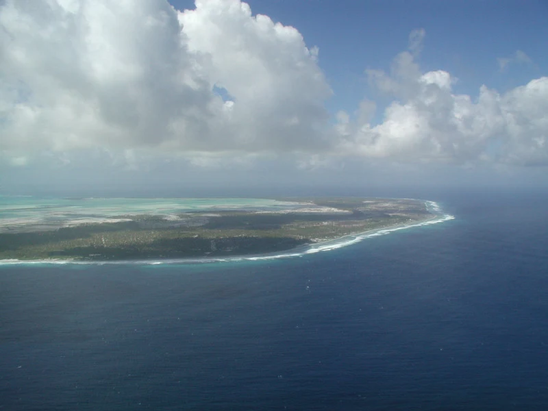 Shallow lagoon and coral flats of Kiritimati seen from above.