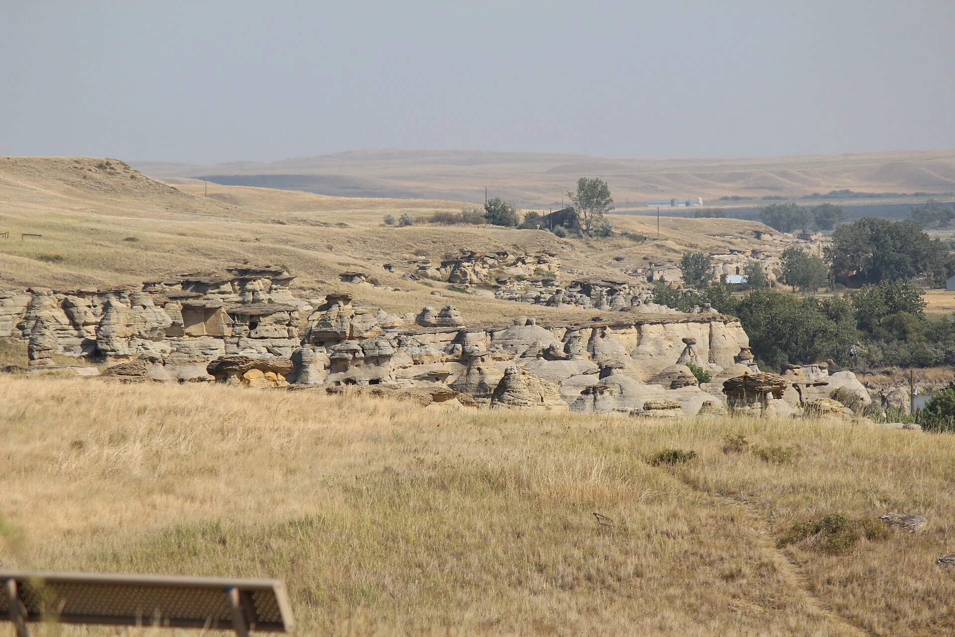 Sandstone hoodoos and the Milk River valley at Áísínai’pi