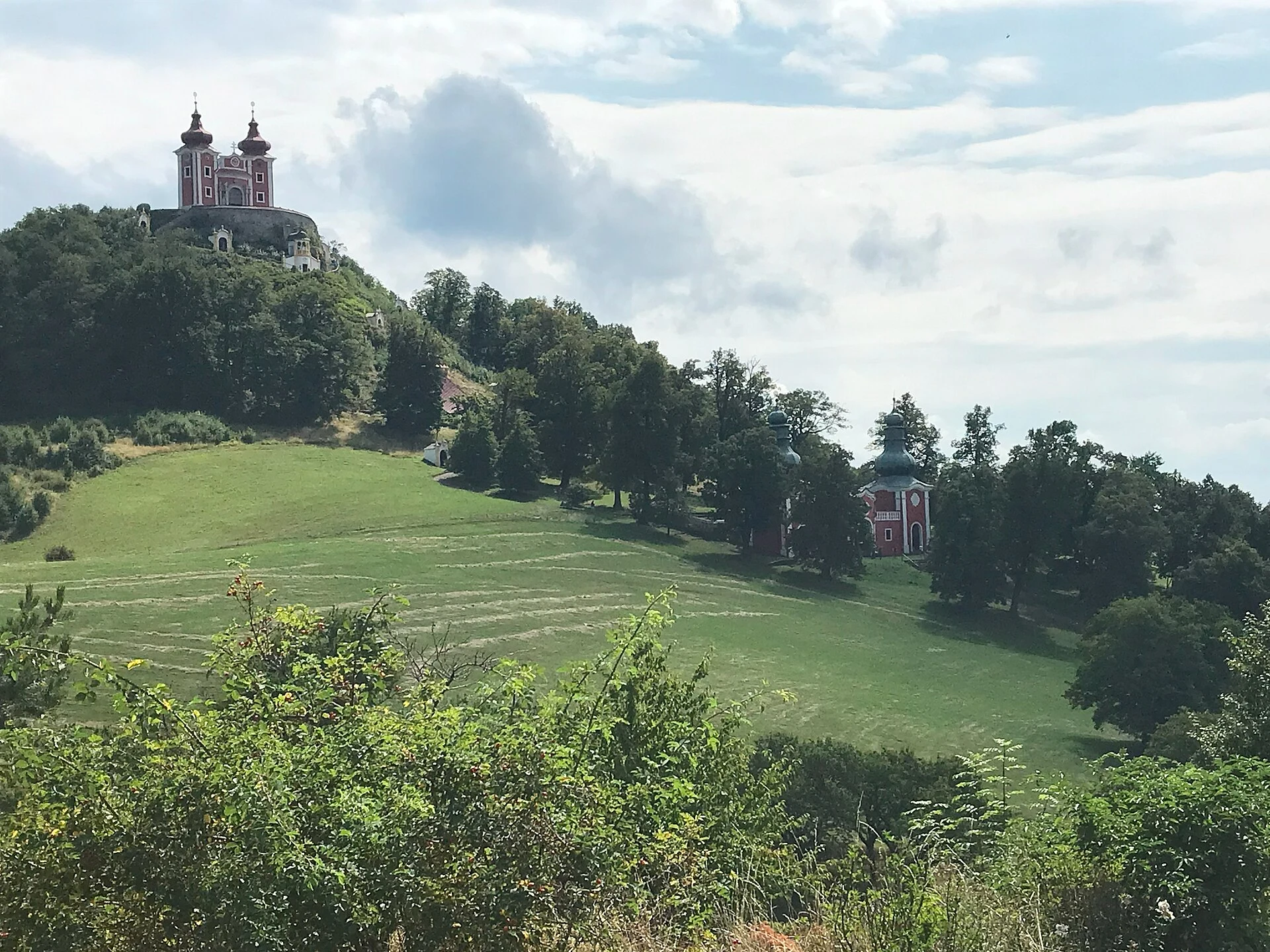 Historic Ottergrund reservoir in forested hills near Banská Štiavnica.