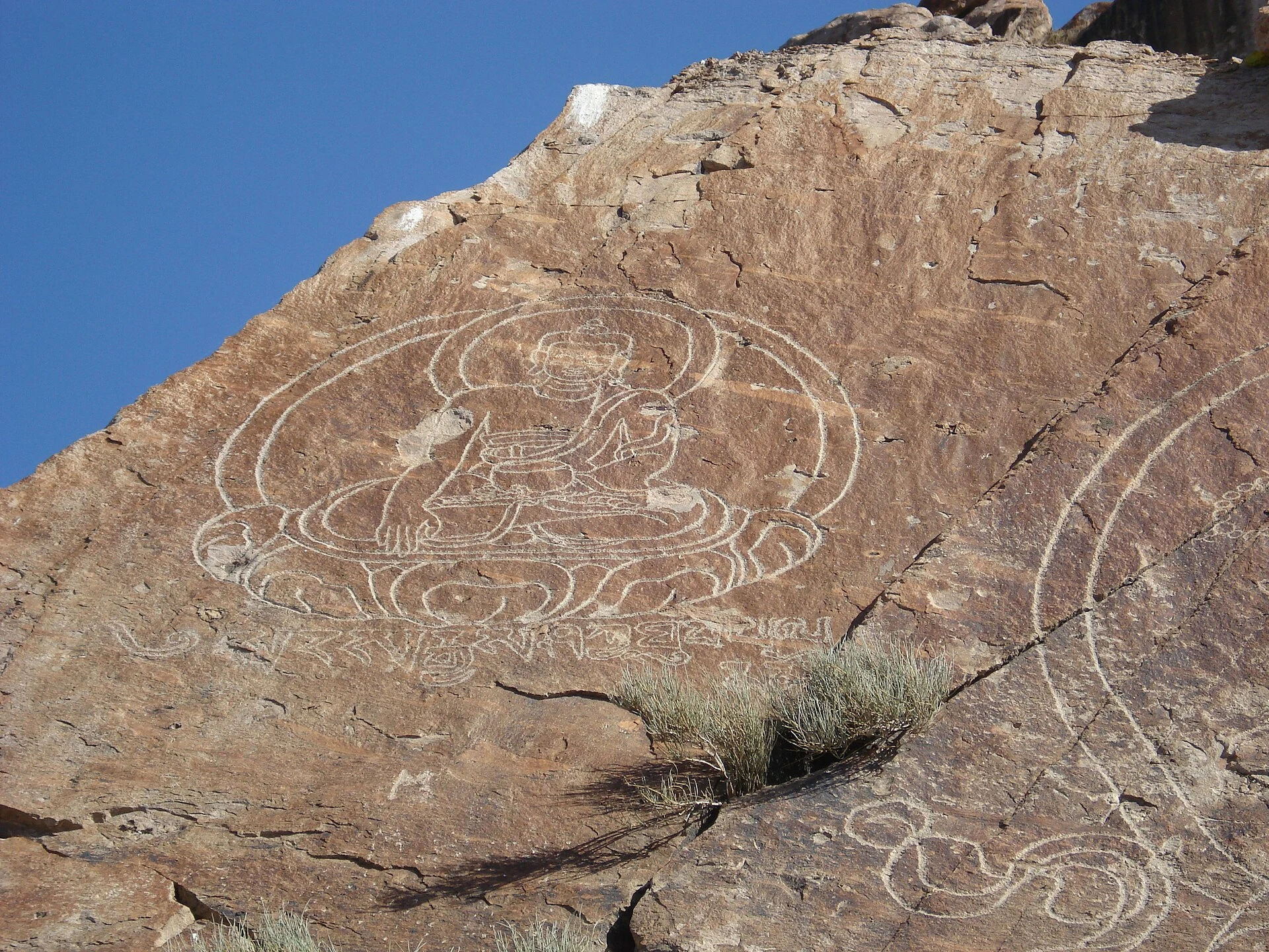 Rocks with Buddhist carvings beside the Ili River at Tamgaly-Tas.