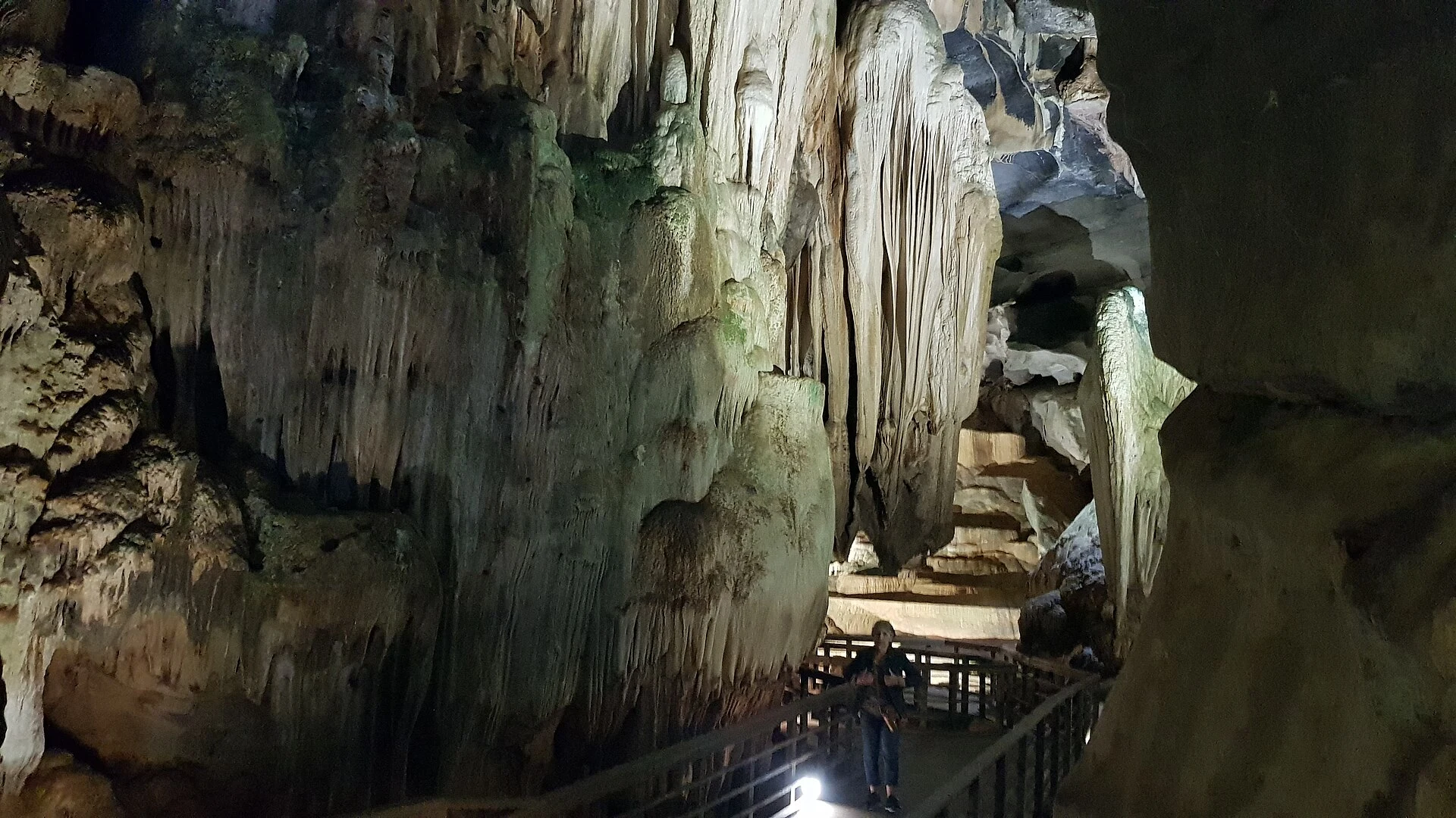Visitor boat approaching the entrance to Phong Nha Cave on the Son River.