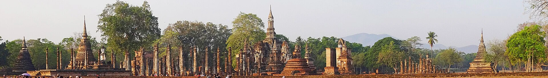 Bicycle beside ancient temples in Sukhothai Historical Park.