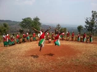Hilltop setting and traditional architecture at Gishora sanctuary.