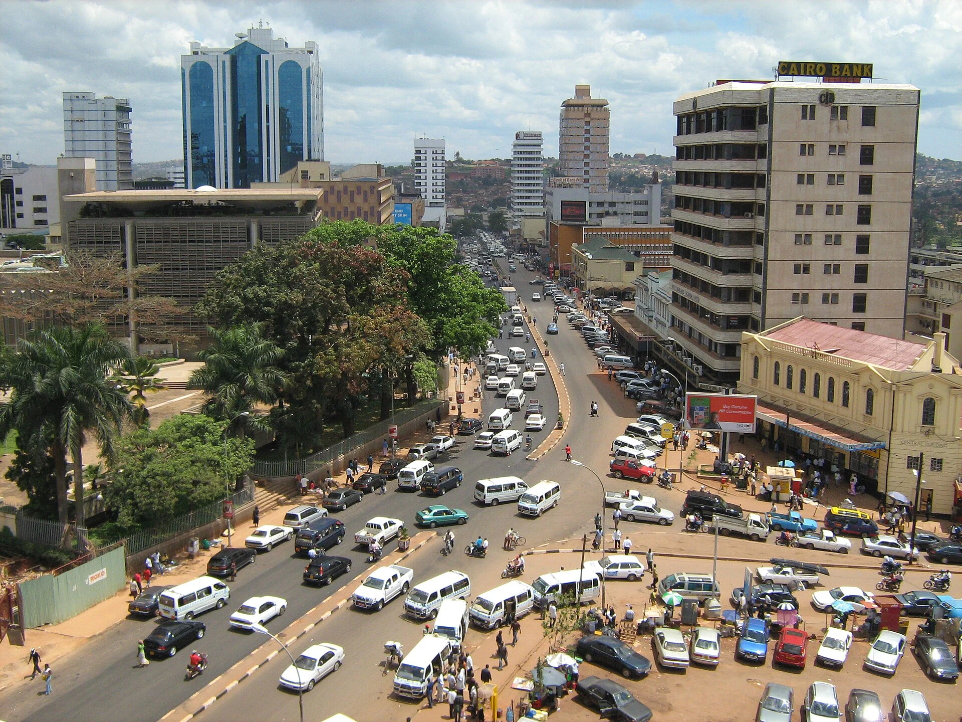 Generic urban scene accompanying the reference to Kampala.