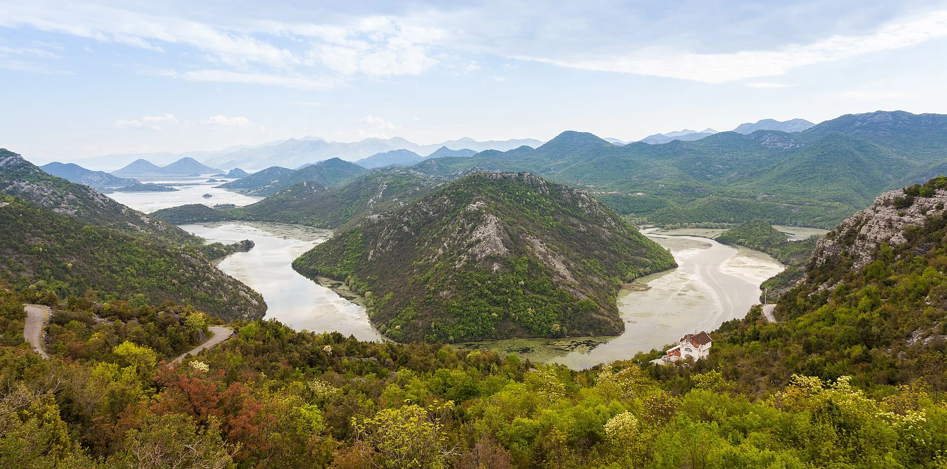 Panoramic view of the meanders and mountains of Lake Skadar in Montenegro.