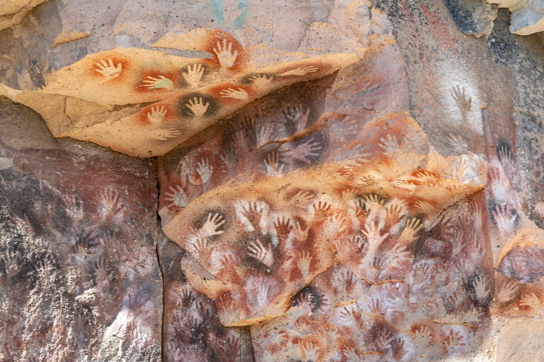Hand stencils painted on rock at Cueva de las Manos.