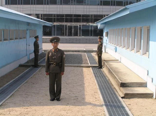 Blue conference buildings in the Joint Security Area at Panmunjom.